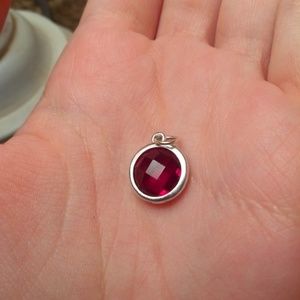 Sterling silver round pendant with red glass